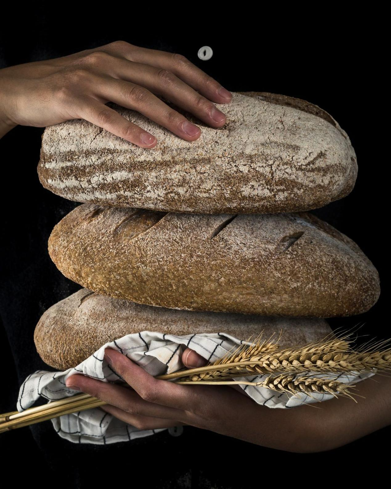 person holding baked bread